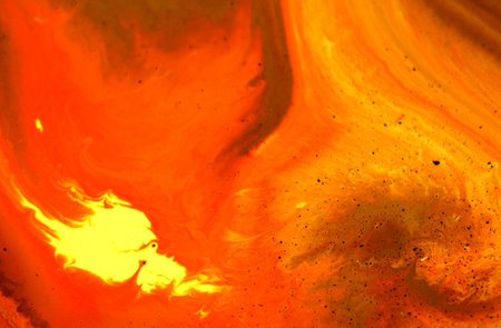 abstract background of watercolors in orange and red tones.