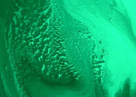 abstract green background of watercolors on paper close-up