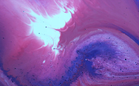 Abstract background of acrylic paint in blue and pink tones. Liquid marble pattern.