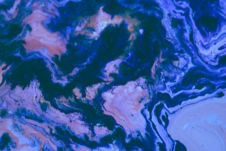Abstract background of acrylic paint in blue and purple tones. Liquid marble pattern.