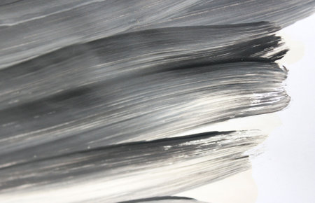 close up of oil paint brush strokes on white paper - abstract background