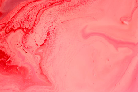 Abstract background of pink fluid. Close-up shot. Pink fluid texture.