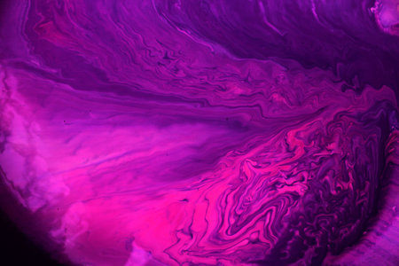 Abstract background of lilac-pink paint. The acrylic paint flows freely and creates an interesting pattern. Texture, background, abstraction, painting. Background for the cover ofの写真素材