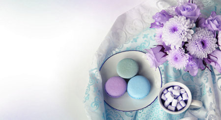 Colorful macaroons and marshmallows on white background.の写真素材