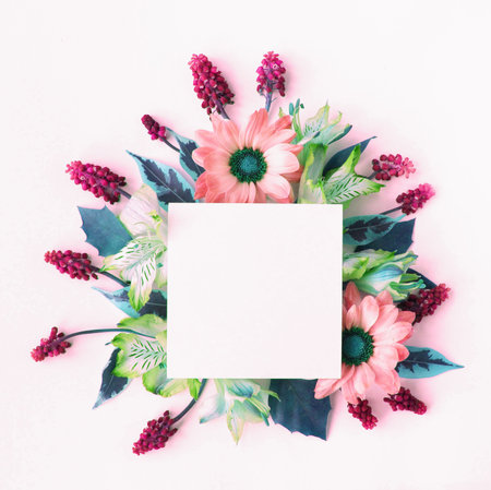 Creative layout made of flowers and leaves. Flat lay, top view minimal floral concept.の写真素材