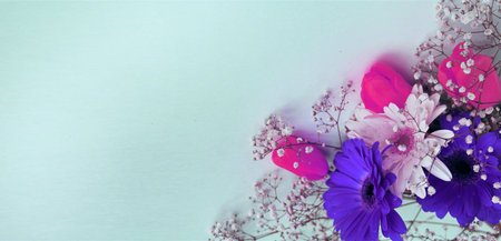 Bouquet of flowers with an Easter egg on a blue backgroundの写真素材