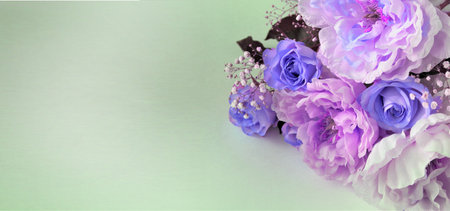 bouquet of flowers on a green background with space for textの写真素材