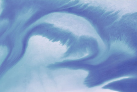 abstract background with blue and white paint splashes in watercolorの写真素材