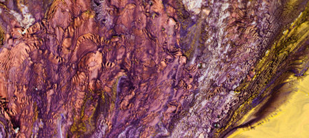 Abstract background of acrylic paint in yellow and purple tones. Fragment of artworkの写真素材