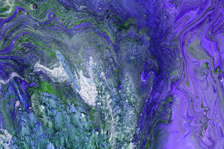 Abstract background of acrylic paint in blue and purple tones. Liquid marble pattern.