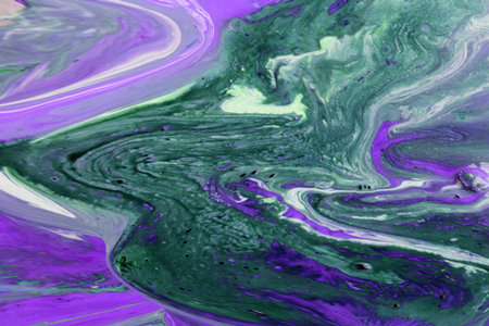 Abstract background of acrylic paint in green and purple tones. Liquid marble texture.の写真素材