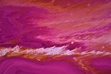 Abstract background of acrylic paint in pink and yellow tones. Liquid marbling texture.