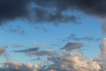 Cloudscape, Colored Clouds at Sunset near the Ocean in a Blue Sky