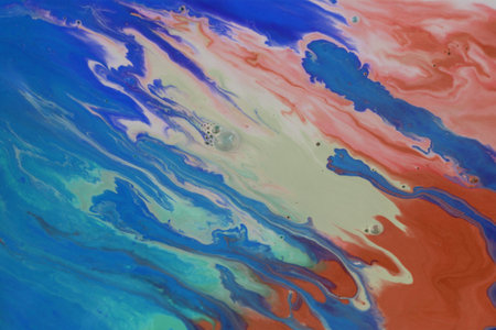 Abstract background of acrylic paint in blue and red tones, close-up