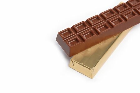 Chocolate bar in foil isolated on white backgroundの写真素材
