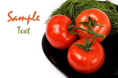 Fresh tomatoes on a plate, isolated on a white background の写真素材