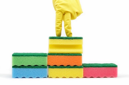 Number one. Rubber gloves and a cleaning sponges on a white background.の写真素材