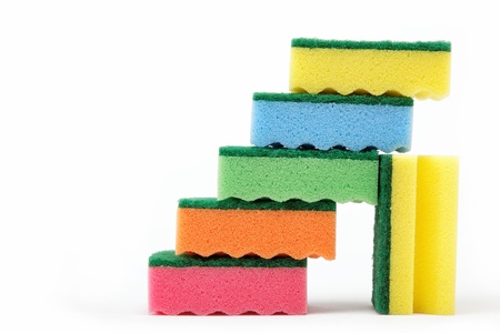 Stack of cleaning sponges on a white background.の写真素材