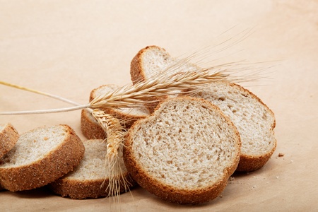 Fresh bread isolated on a light brown background.の写真素材