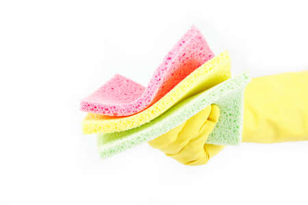 Hand with rubber glove and cleaning sponge on white background