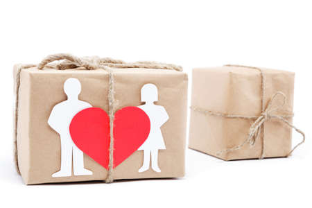 Vintage gift with a red valentine heart isolated on white background.の写真素材