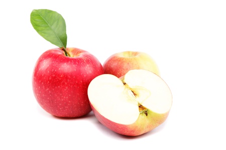 Fresh red apples with a slice isolated on white background.の写真素材