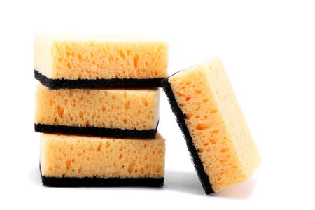 Stack of cleaning sponges on a white background.の写真素材