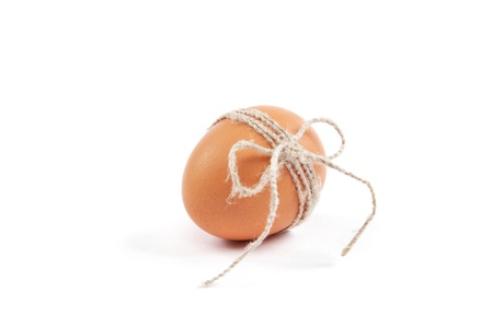 Brown egg isolated on a white background.の写真素材