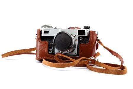 Old camera with case isolated on white background.の写真素材