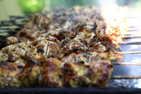 Shish kebab on the grill with smoke.