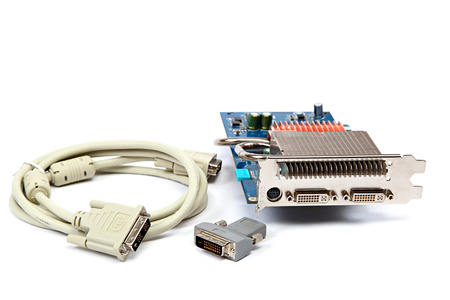 DVI cable, adapter and video graphic card isolated on a white background.