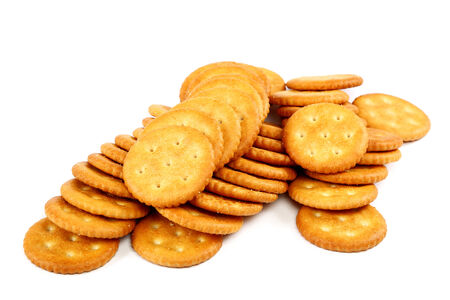 Stack of cracker biscuits isolated on a white background の写真素材
