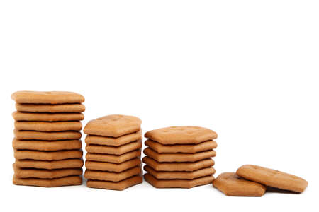 Stack of cracker biscuits isolated on a white background.の写真素材
