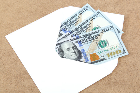 Money in envelope on wooden background.の写真素材