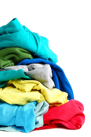 Pile of clothes washing isolated on white background.の写真素材