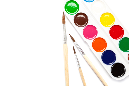 Watercolor paints and brushes isolated on a white background.の写真素材