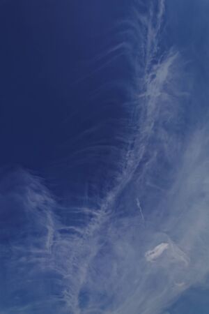 Blue sky with white cumulus clouds.の写真素材