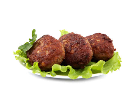 Meat patties with fresh lettuce isolated on a white background.の写真素材