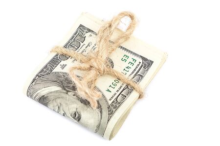 Roll of dollar banknotes isolated on white background.