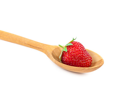 Fresh strawberries in wooden spoon isolated on a white background.の写真素材