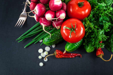 Fresh vegetables on a black background.の写真素材