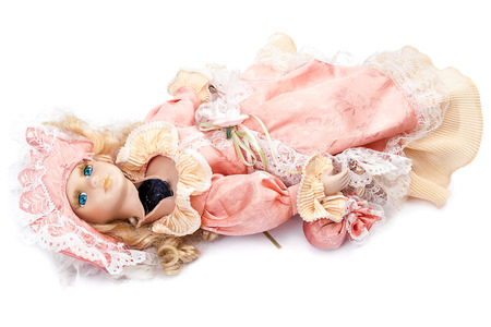 Broken doll isolated on white background.の写真素材