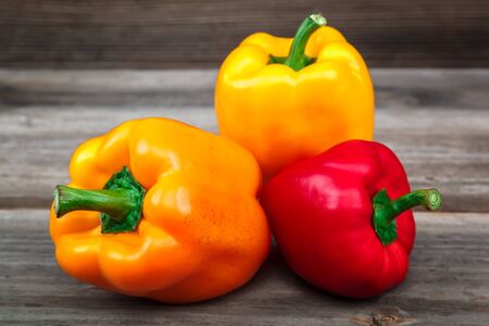 Fresh sweet bell peppers on wooden boards.の写真素材