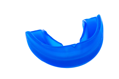 Blue mouthguard isolated on white background.の写真素材