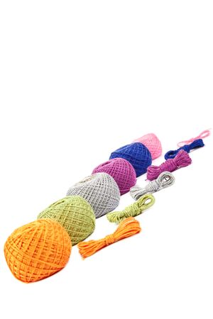 Colored sewing knitting skeins isolated on white background.
