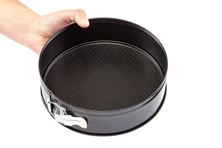 Baking dish in hand isolated on white background.