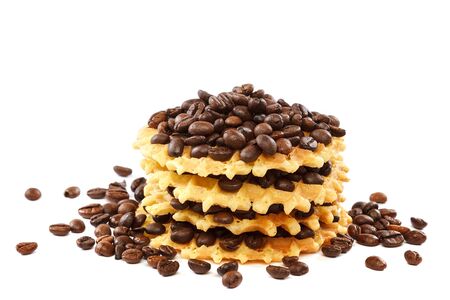 Waffle cookies and coffee grains isolated on a white background.の写真素材