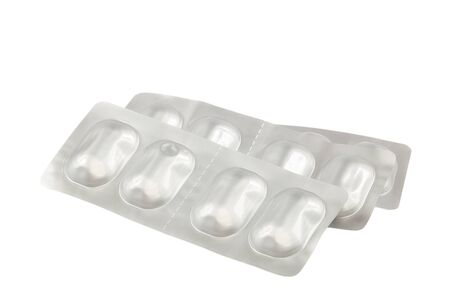 Pills in blister packs isolated on white background.