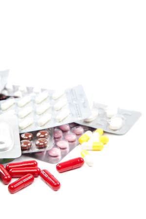 Pills, capsules in blister packs isolated on white background. Medicines and drugs.の写真素材