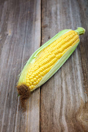 Corn on the background of the wooden planks.の写真素材